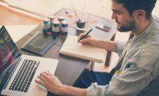 Handsome Hipster Modern Man Working Home Using Laptop