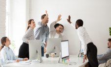 Happy Multi Ethnic Employees Sales Team Giving High Five Togethe