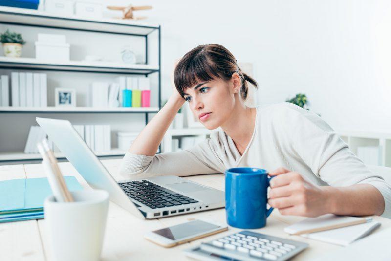 Tired Woman At Office Desk